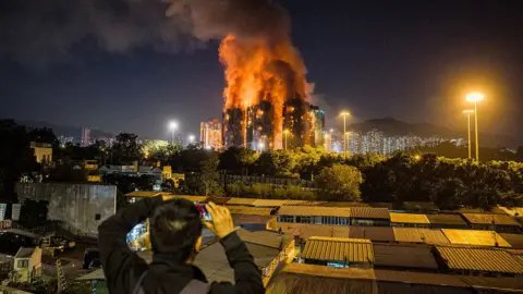 Deadly Blaze Engulfs Hong Kong Apartments, Leaving 13 Dead and Numerous Injured