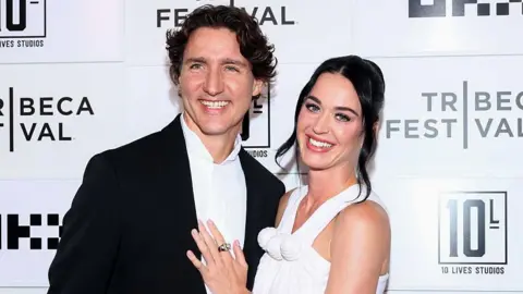 Boyfriend duties call, Trudeau says after skipping Canada match to watch Perry