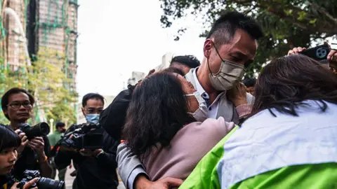 Tragedy Strikes: Families Search for Missing Loved Ones After Devastating Hong Kong Blaze