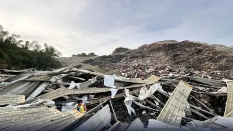 Tragedy Strikes as Landfill Collapse in Philippines Claims One Life and Traps Dozens