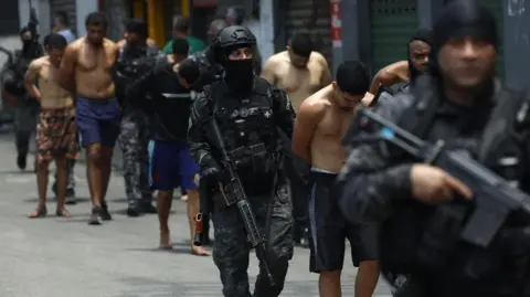 Devastation in Penha: Photographer Captures Aftermath of Deadly Police Raid in Rio